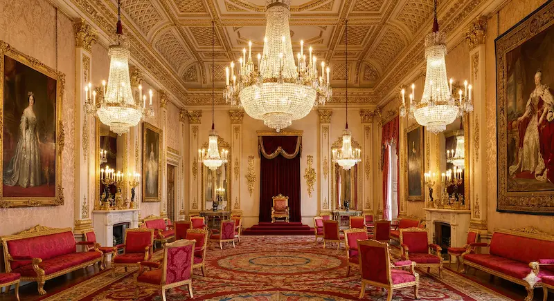 Luxurious interior of Buckingham Palace State Room with gold ornaments